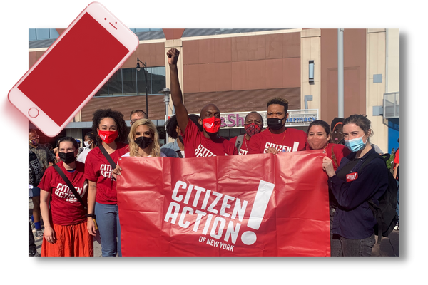 Citizen Action members at a march in downtown Brooklyn holding an organizational banner.